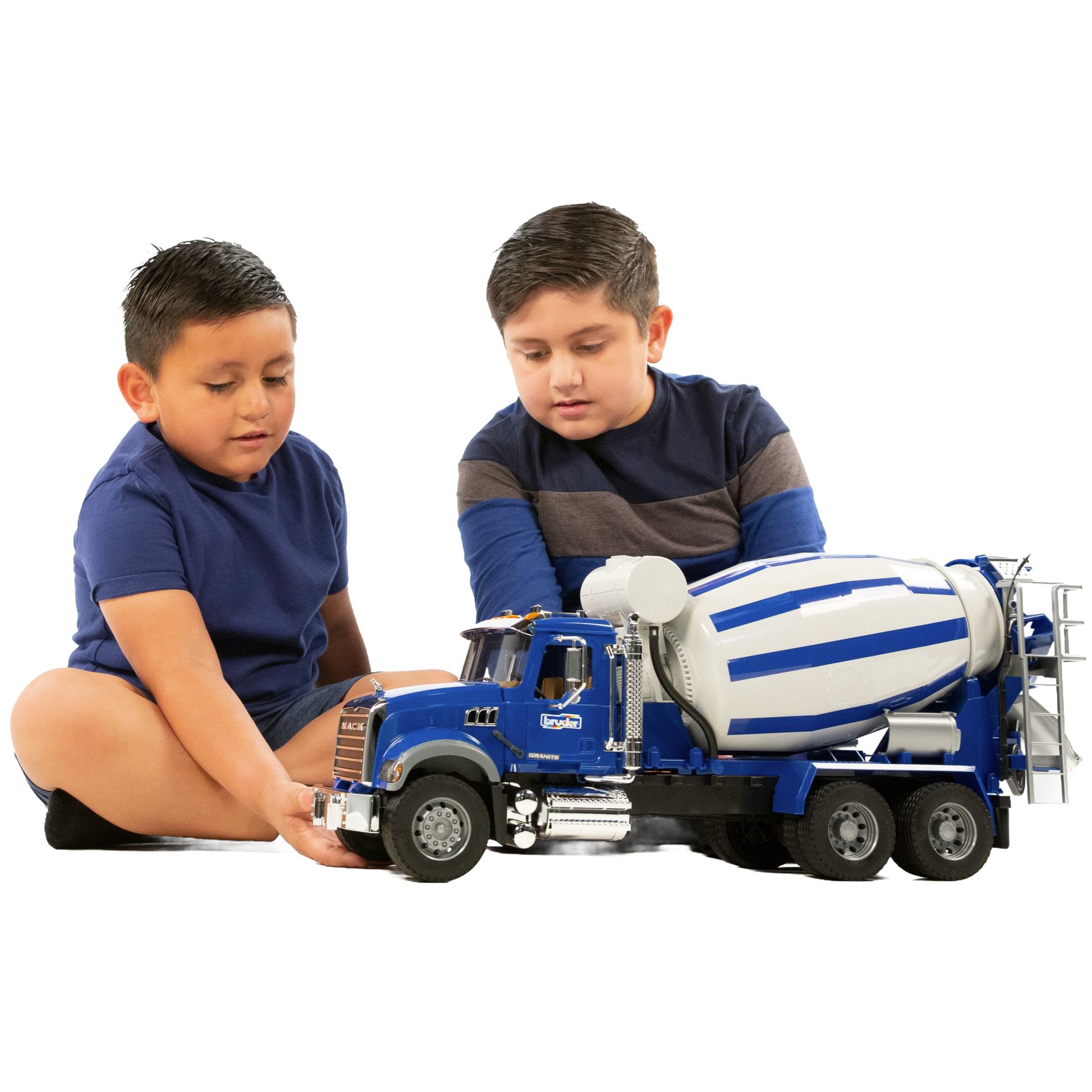 Two boys playing with blue Bruder 1:16 scale Mack Granite cement mixer truck from Toys & Games collection