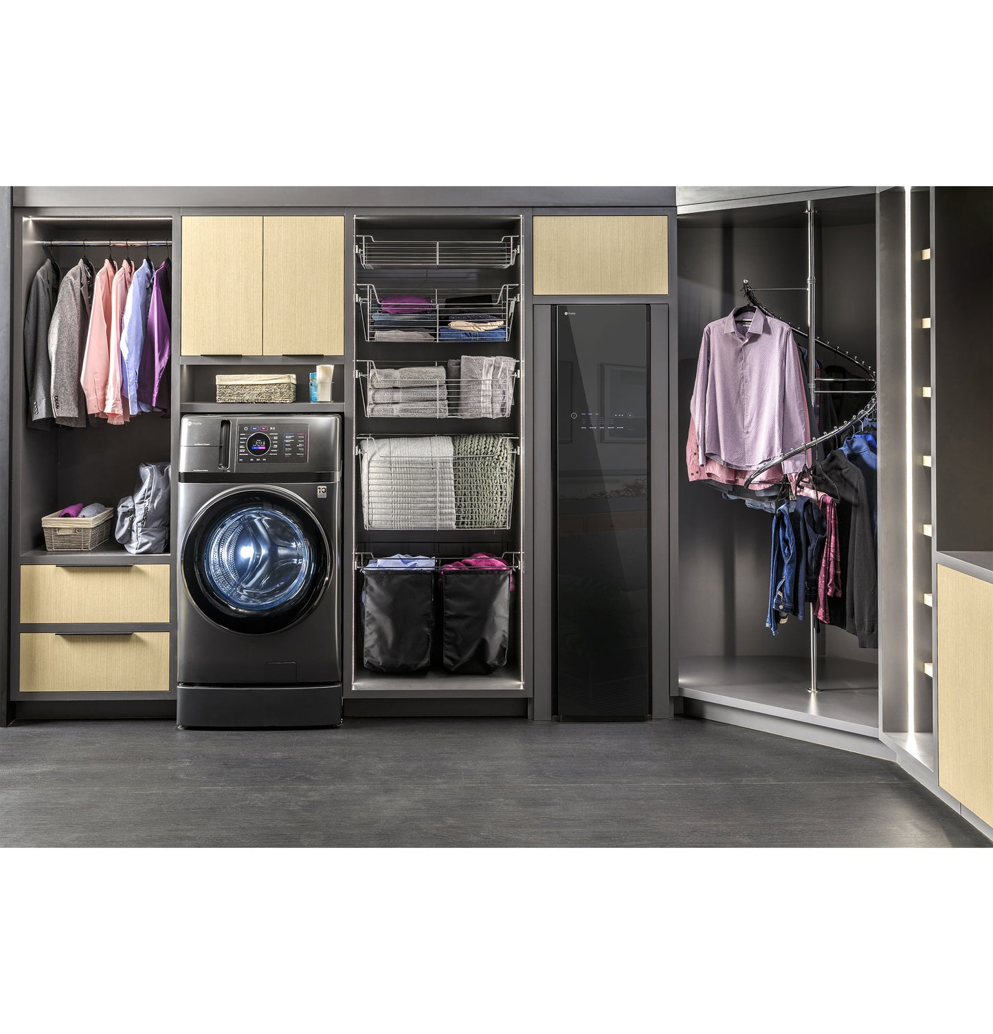Modern laundry center featuring front load washer and Steam Closet with Fabric Refresh in organized cabinetry setting