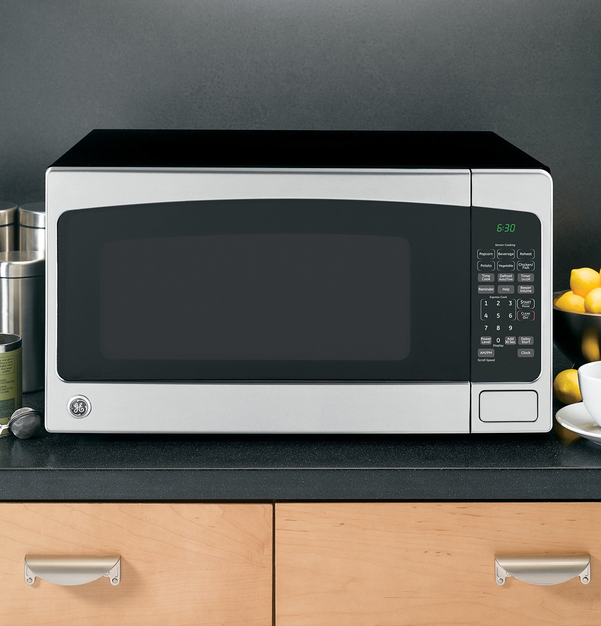 Stainless steel countertop microwave oven with digital control panel on kitchen counter from Countertop Microwaves collection