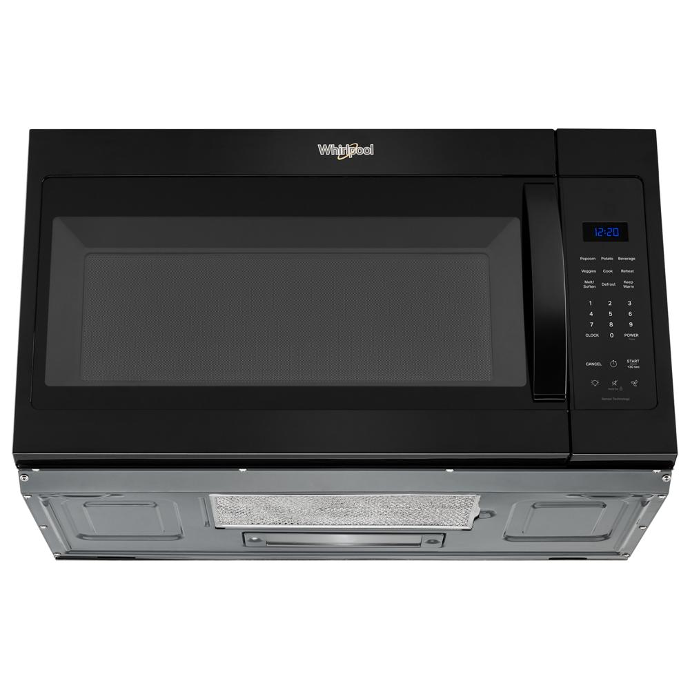 Black Whirlpool over-the-range microwave with sensor cooking controls and vent in a kitchen appliance setting