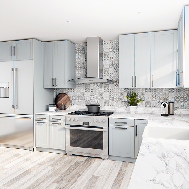 stainless steel curved glass wall-mounted range hood installed above stainless steel gas stove in modern kitchen