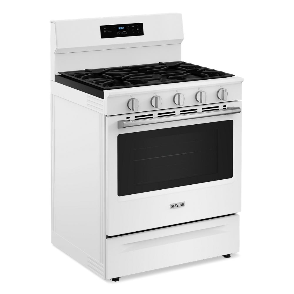 White 30-inch freestanding gas range with five control knobs, digital display, and large oven window in kitchen appliances collection
