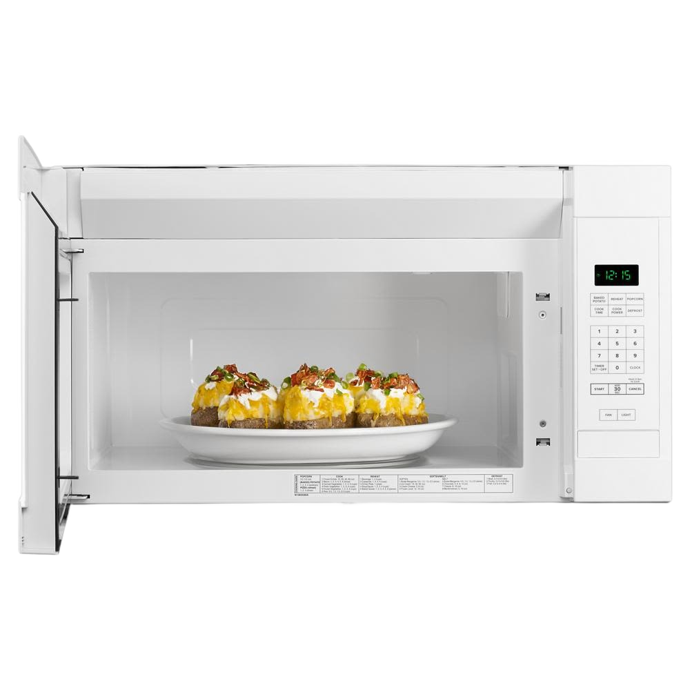 White over-the-range microwave with digital control panel and plate of loaded baked potatoes inside in kitchen appliances collection