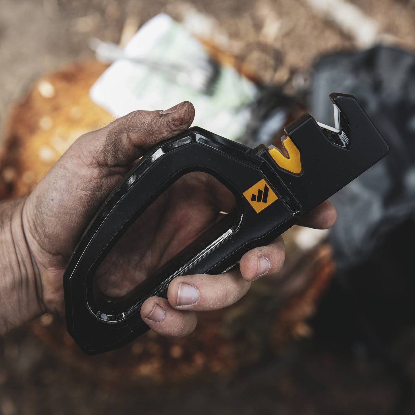 Black and yellow handheld knife sharpener with ergonomic grip for precision sharpening in kitchenware and kitchen gadgets collections