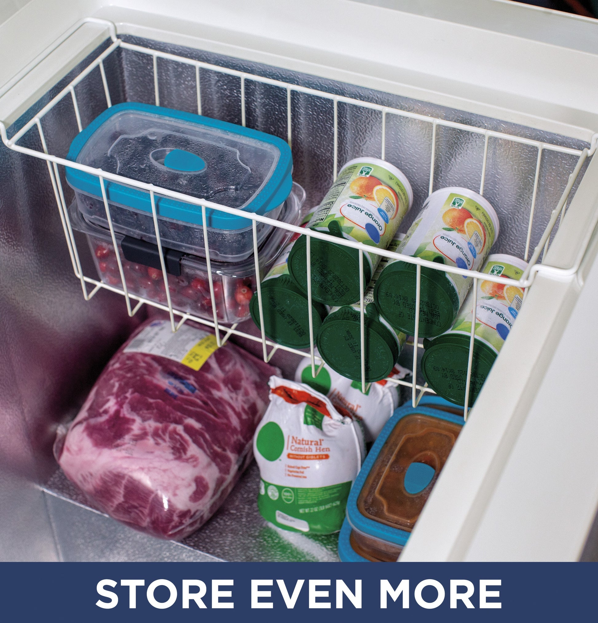 Interior view of chest freezer with food containers, frozen meat, and packaged goods for kitchen and home appliances.