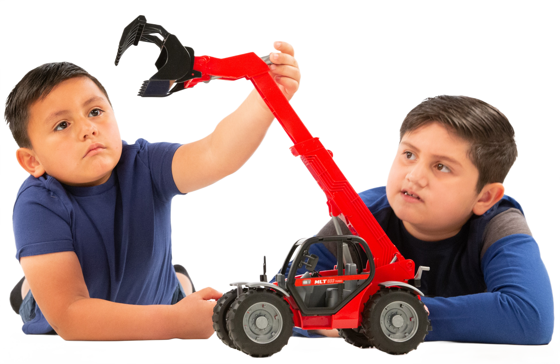 Two boys playing with a red Bruder Manitou MLT 633 Turbo Telescopic Loader toy in Vehicles & Remote Controlled Toys collection