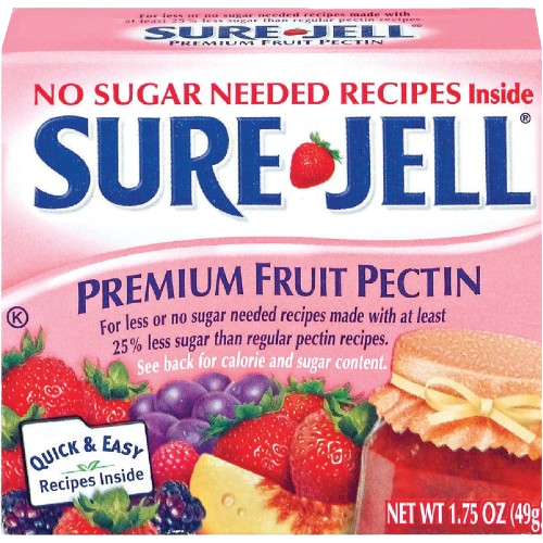 Pink Sure-Jell fruit pectin box with strawberries, grapes, and jam jar for homemade preserves and canning use