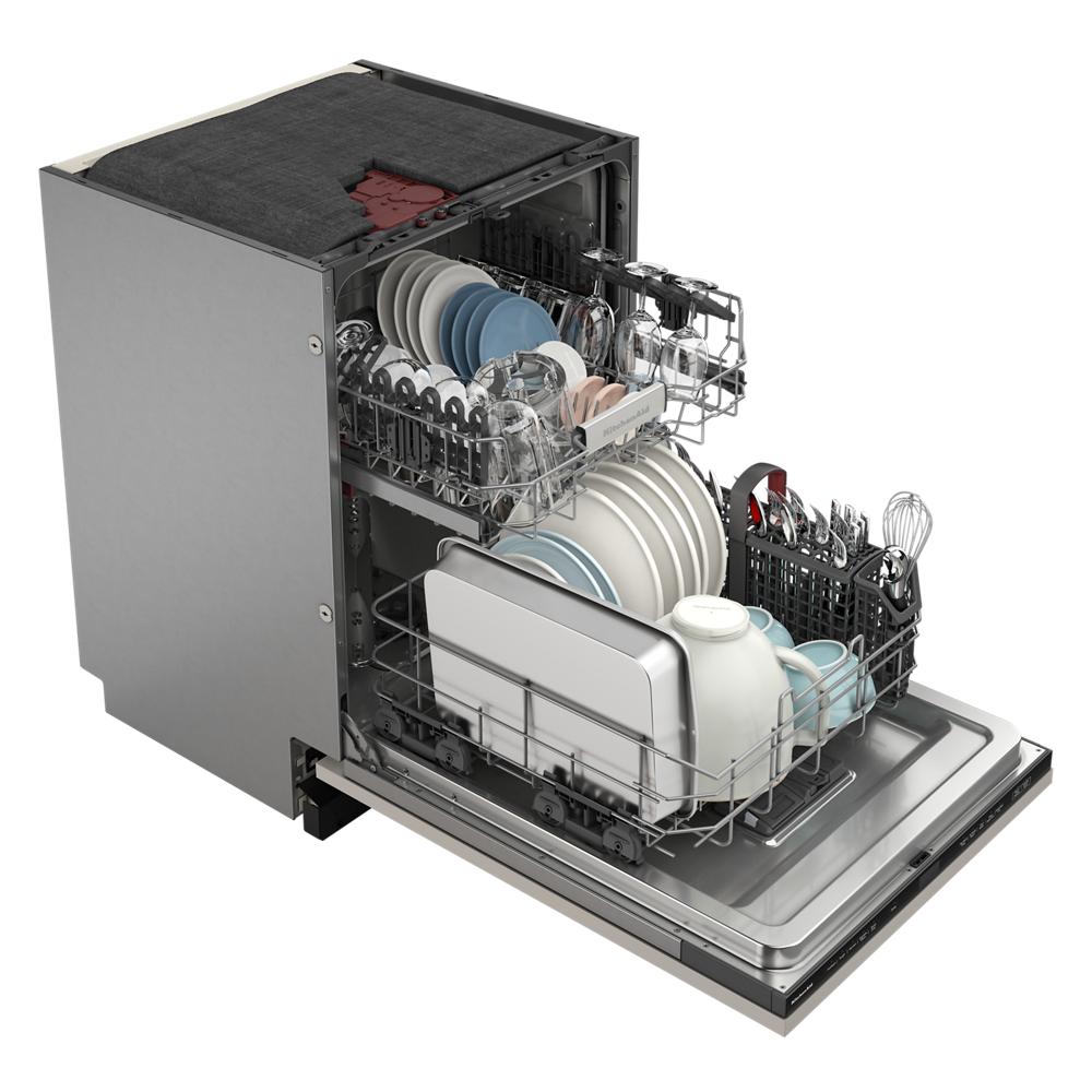 Open panel-ready dishwasher with two racks loaded with various plates, bowls, and utensils in kitchen appliances category