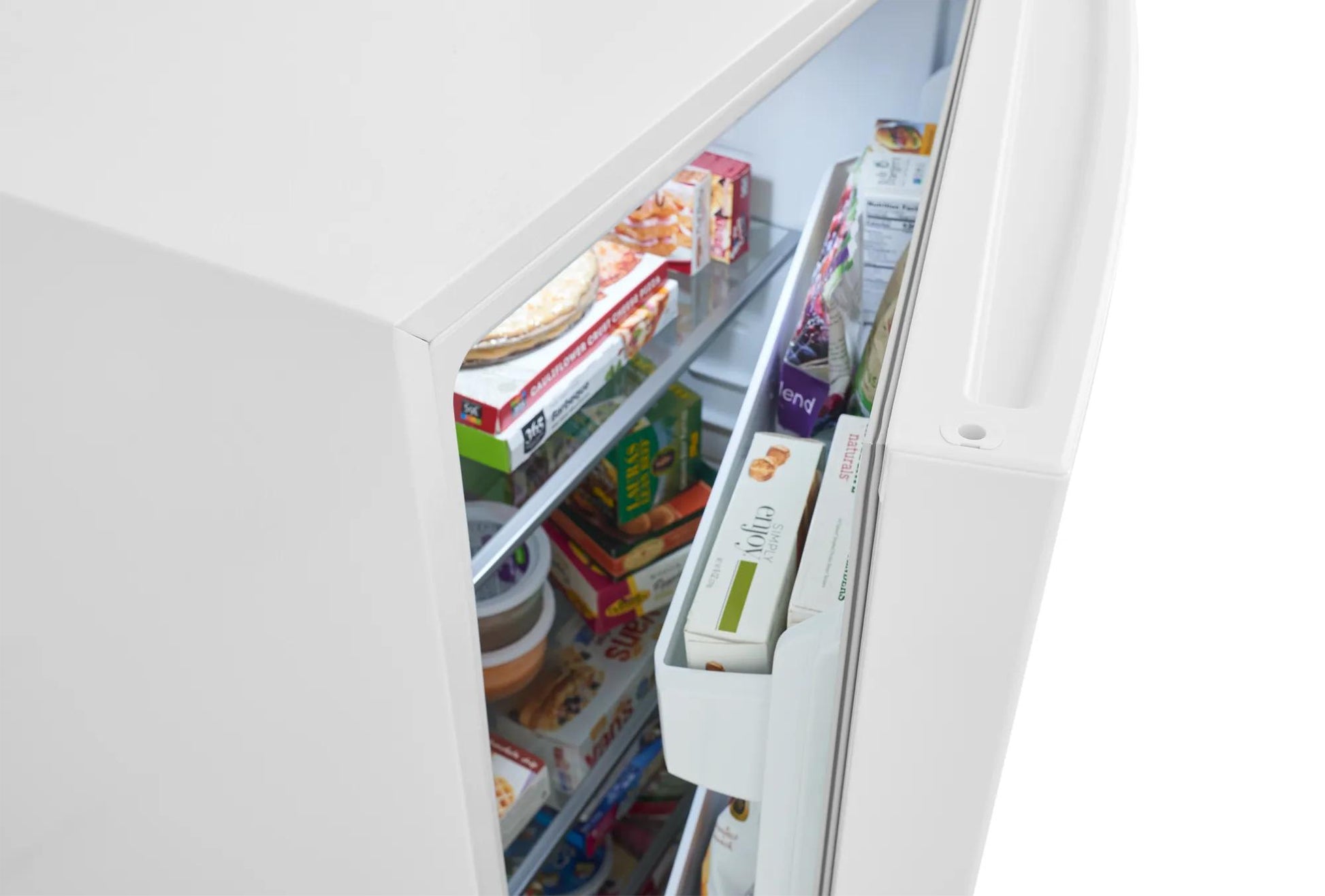 Partially open white upright freezer showing organized interior shelves and door storage from freezers collection