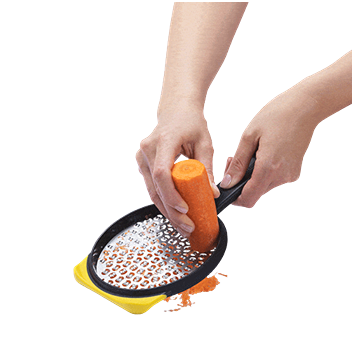 Hand using yellow medium two-sided grater with ergonomic handle in kitchenware and gadget tools under $50 collections