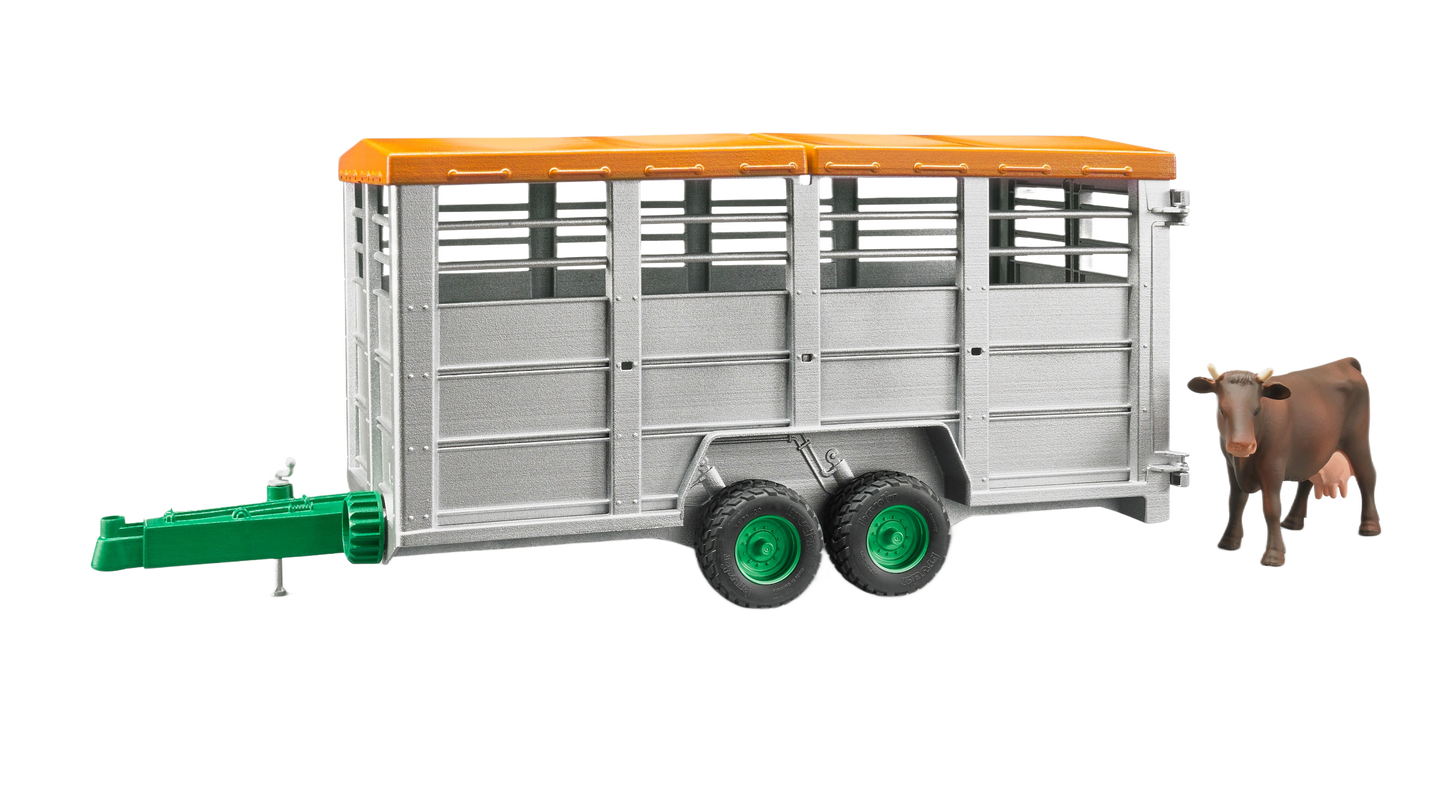 Miniature livestock trailer with orange roof and green hitch, accompanied by a brown and black toy cow figure