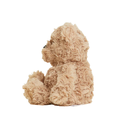Curly plush bear in soft brown fabric designed for microwavable warmth and comforting cuddle moments