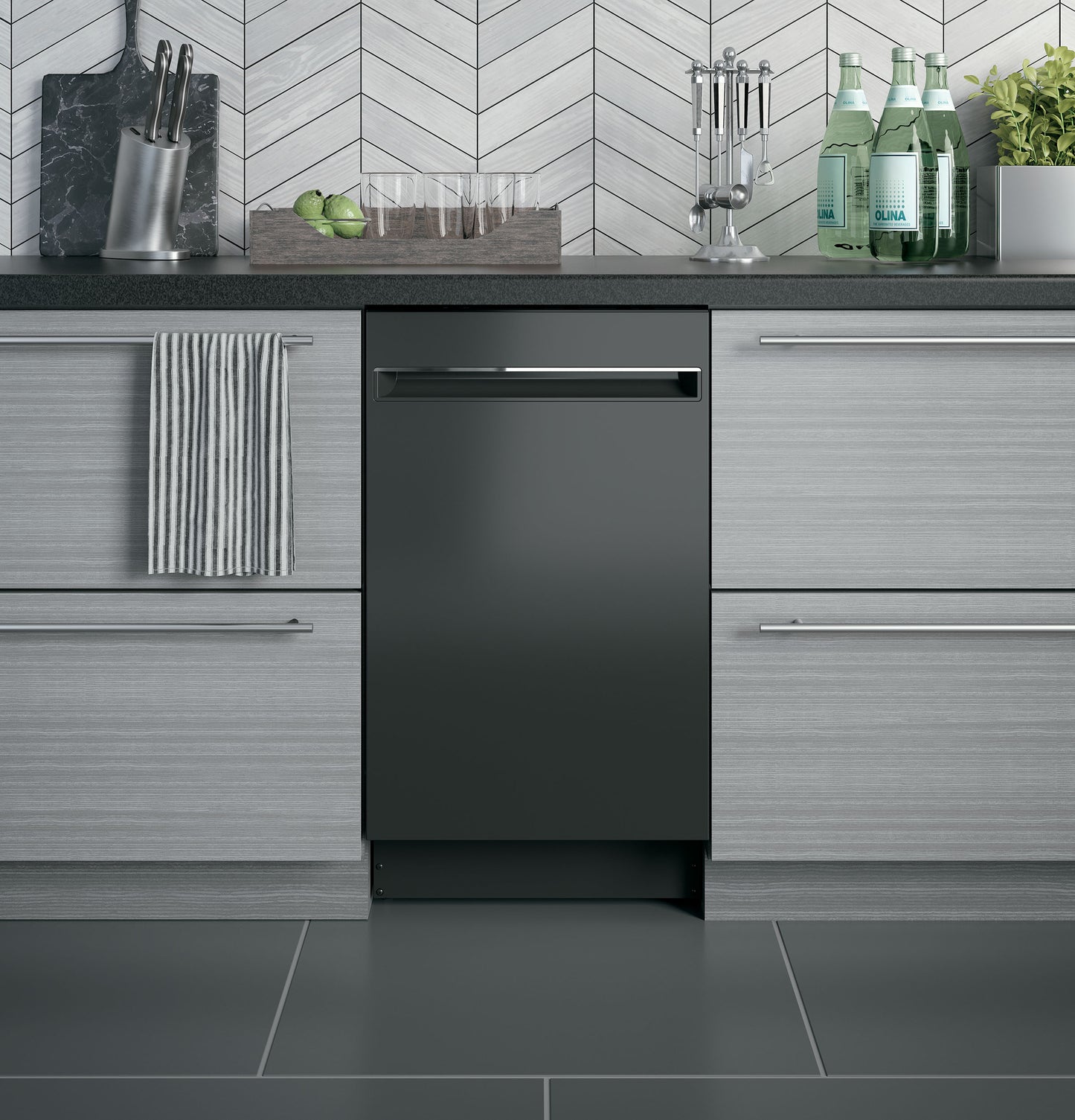 Built-in black dishwasher integrated into modern gray cabinetry in a kitchen with tile backsplash and countertop accessories