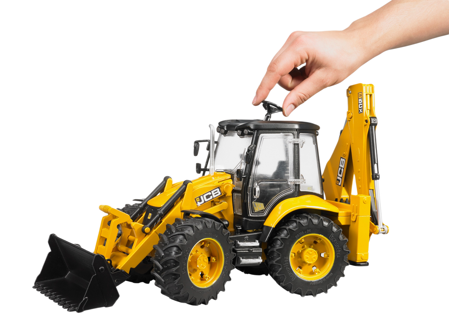 Hand adjusting the yellow Bruder Toys JCB 5CX Eco backhoe loader model in vehicles & toys collections under $100