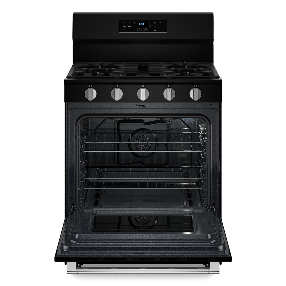 Front view of black 30-inch gas range with five burners and open oven door showing racks for kitchen appliances and home improvement use