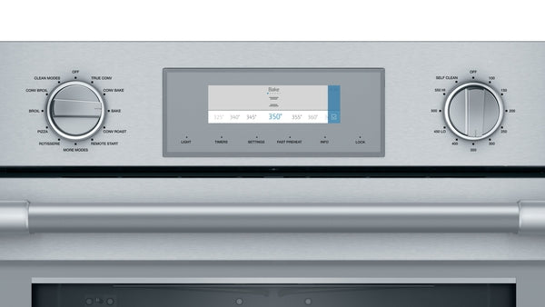 Stainless steel oven control panel with digital touch screen and dual function knobs from Thermador wall ovens collection