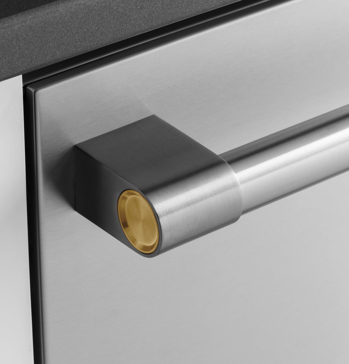 Close-up of stainless steel dishwasher handle with gold accent from Built-in Dishwashers and Kitchen & Kitchenware collections