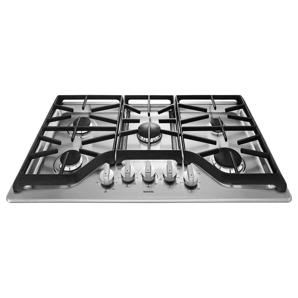 Stainless steel 36-inch gas cooktop with five burners and durable black cast iron grates for home cooking tasks