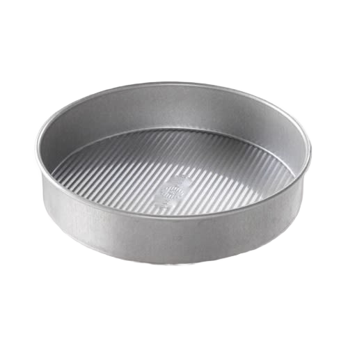 Round metal baking pan with ribbed interior for even heat distribution in home baking and cooking tasks