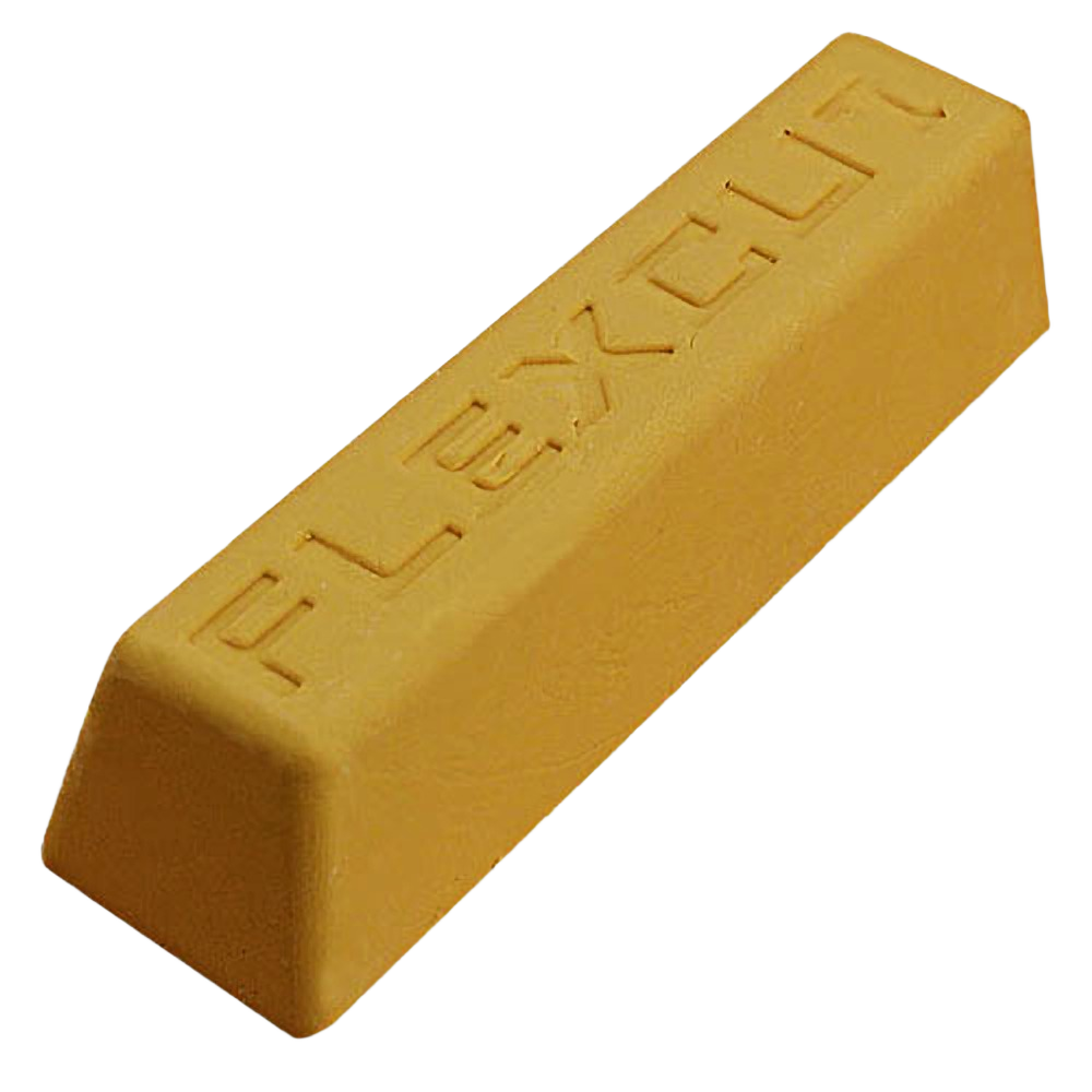 Gold-colored polishing compound bar embossed with brand name for woodworking tool accessories and finishing projects