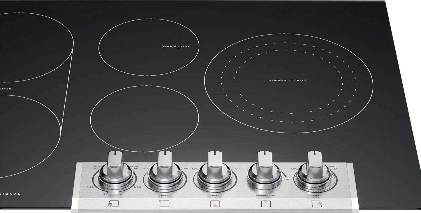 Black radiant electric cooktop with five burners and metallic control knobs from Cooktops and Appliances collections