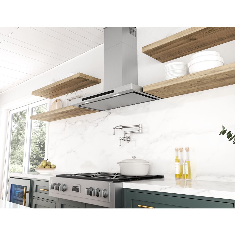 Modern low-profile stainless steel chimney hood with invisible touch controls above gas range in kitchen setting