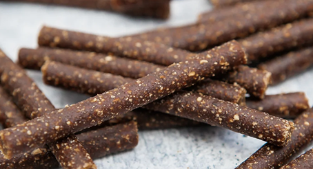 Natural dog treat beef sticks with visible seasoning pieces, part of pet supplies and treats under $50 collection