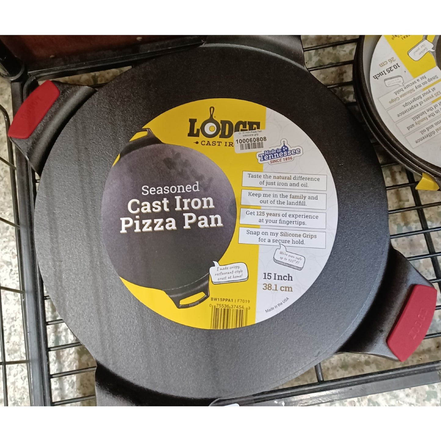 15-inch Lodge cast iron pizza pan with seasoned surface and silicone grip handles in Kitchenware collection under $100