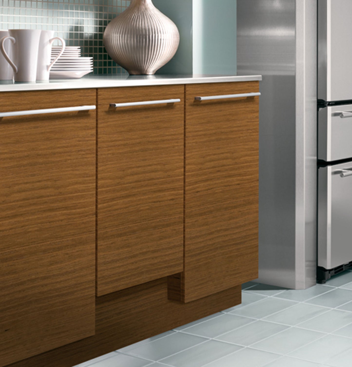 Kitchen cabinetry with integrated panel-ready dishwasher blending seamlessly in modern appliance and kitchenware setup