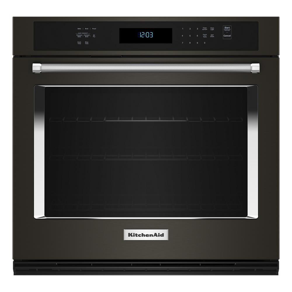 Black single wall oven with digital control panel and stainless steel handle in KitchenAid appliances collection