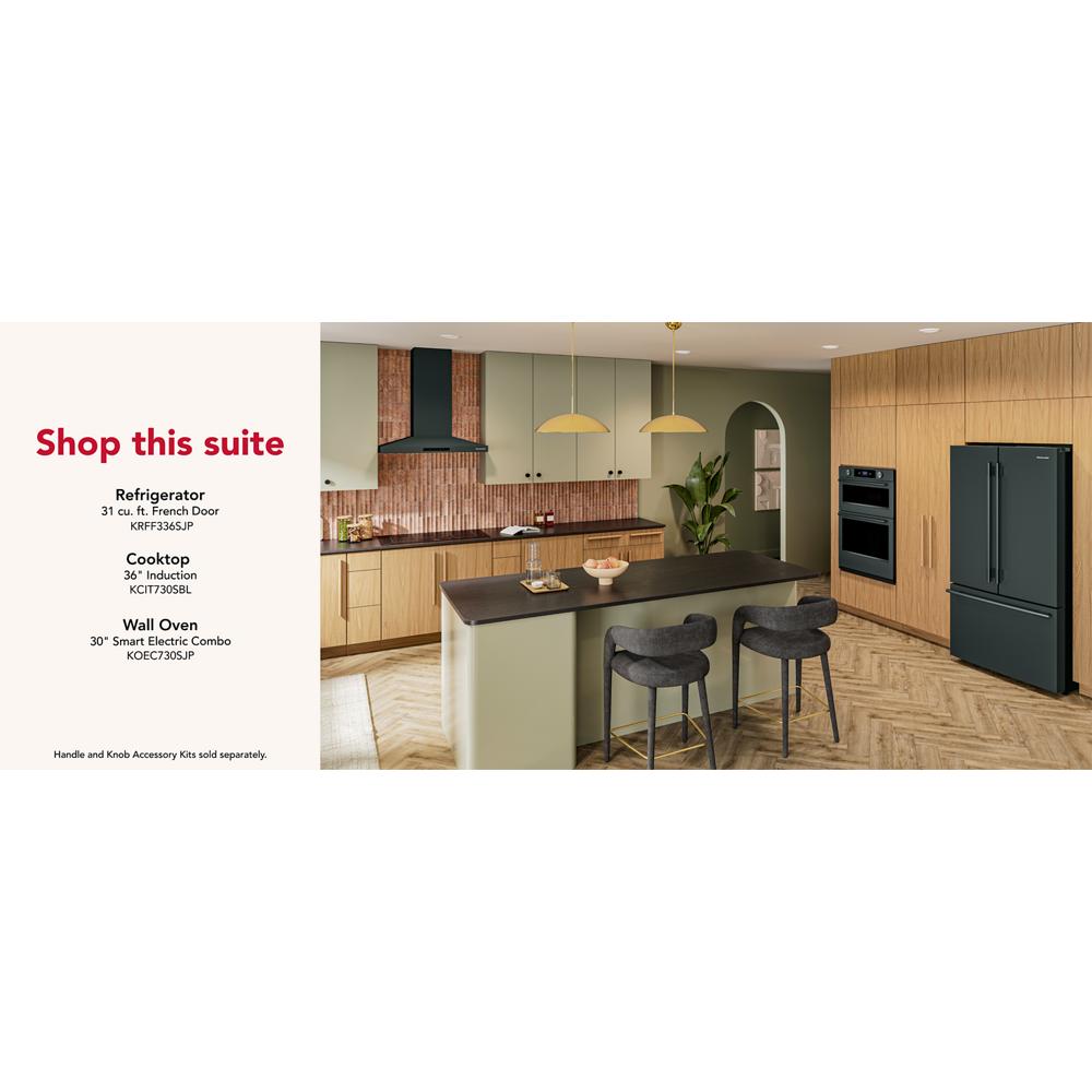 Modern kitchen featuring dark green wall-mount canopy hood with four-speed fan in KitchenAid appliances collection