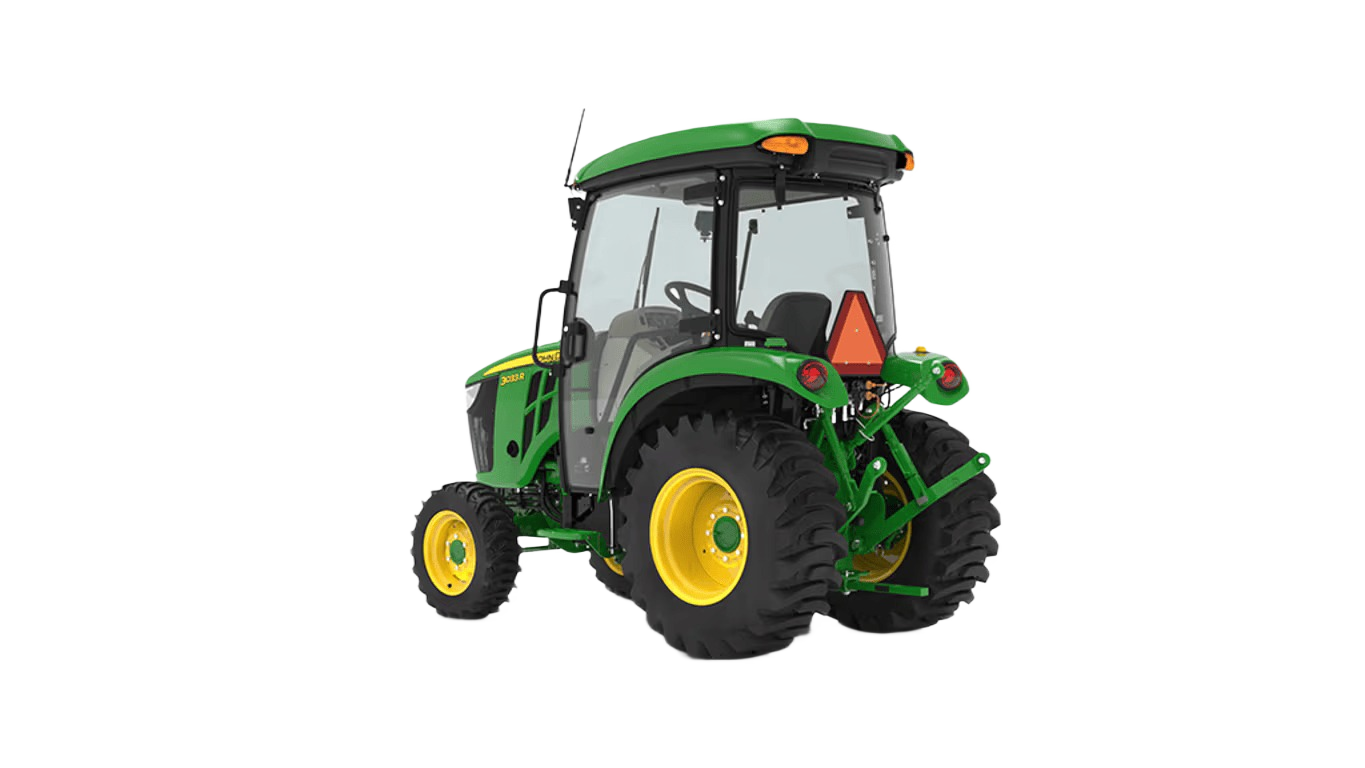 Green John Deere compact tractor with enclosed snow cab and standard seat for tools and home improvement tasks