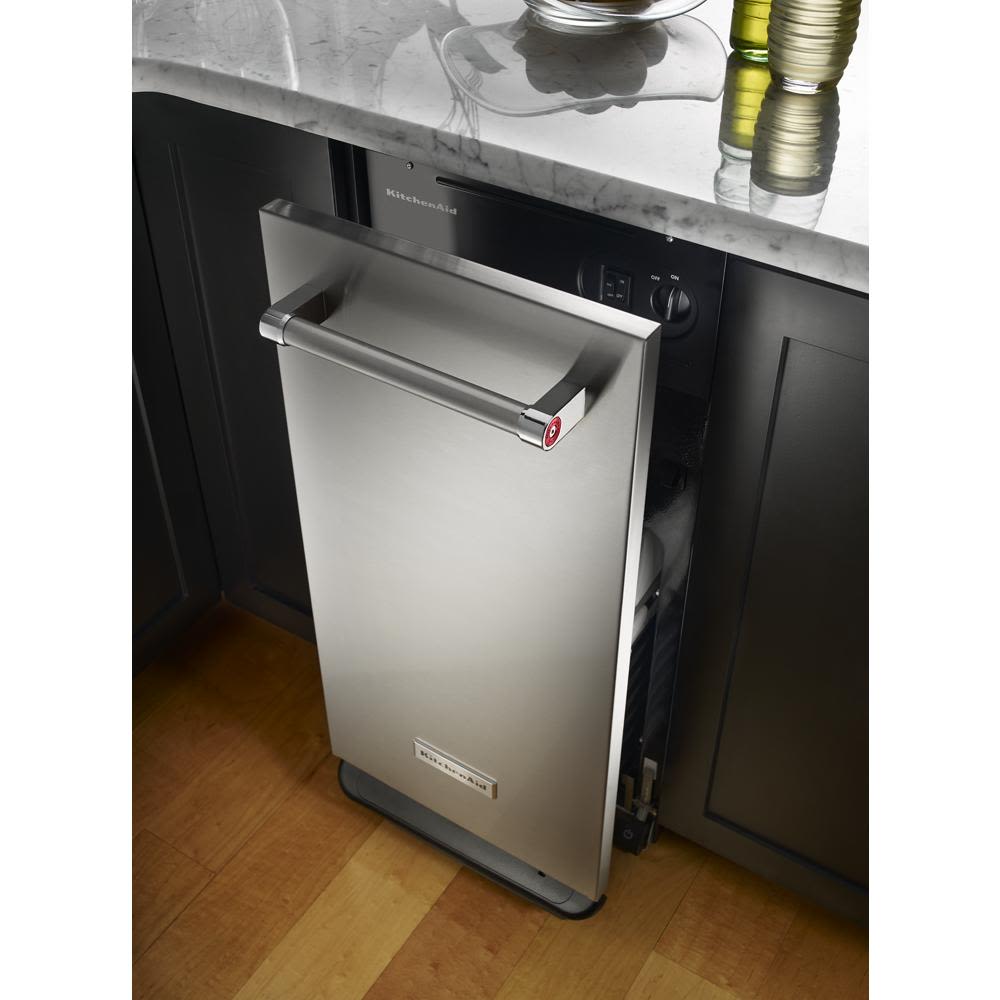 Built-in stainless steel trash compactor with handle and solid pack control in KitchenAid kitchen appliance collections