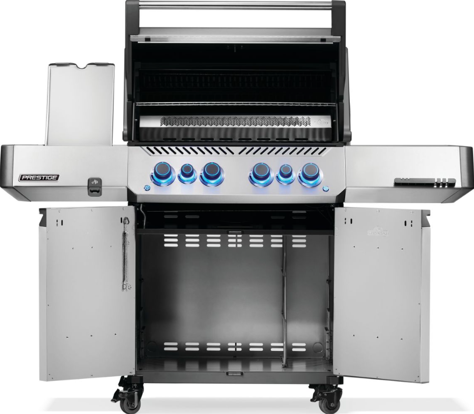 Front view of a stainless steel natural gas grill with six illuminated control knobs, open storage cabinet, side shelves, and rotisserie for outdoor cooking in the gas grills collection.