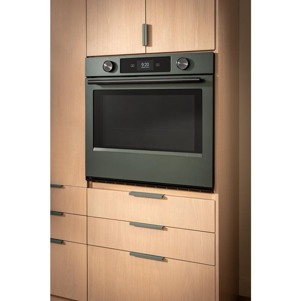 30-inch smart electric wall oven in juniper with LED display and dual control knobs in modern kitchen cabinetry