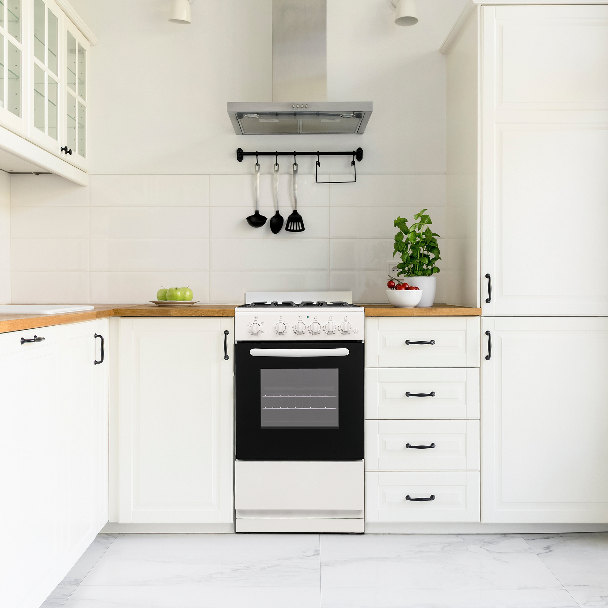 White and black 20-inch gas range with multiple control knobs, oven window, cast iron grates in modern kitchen setting