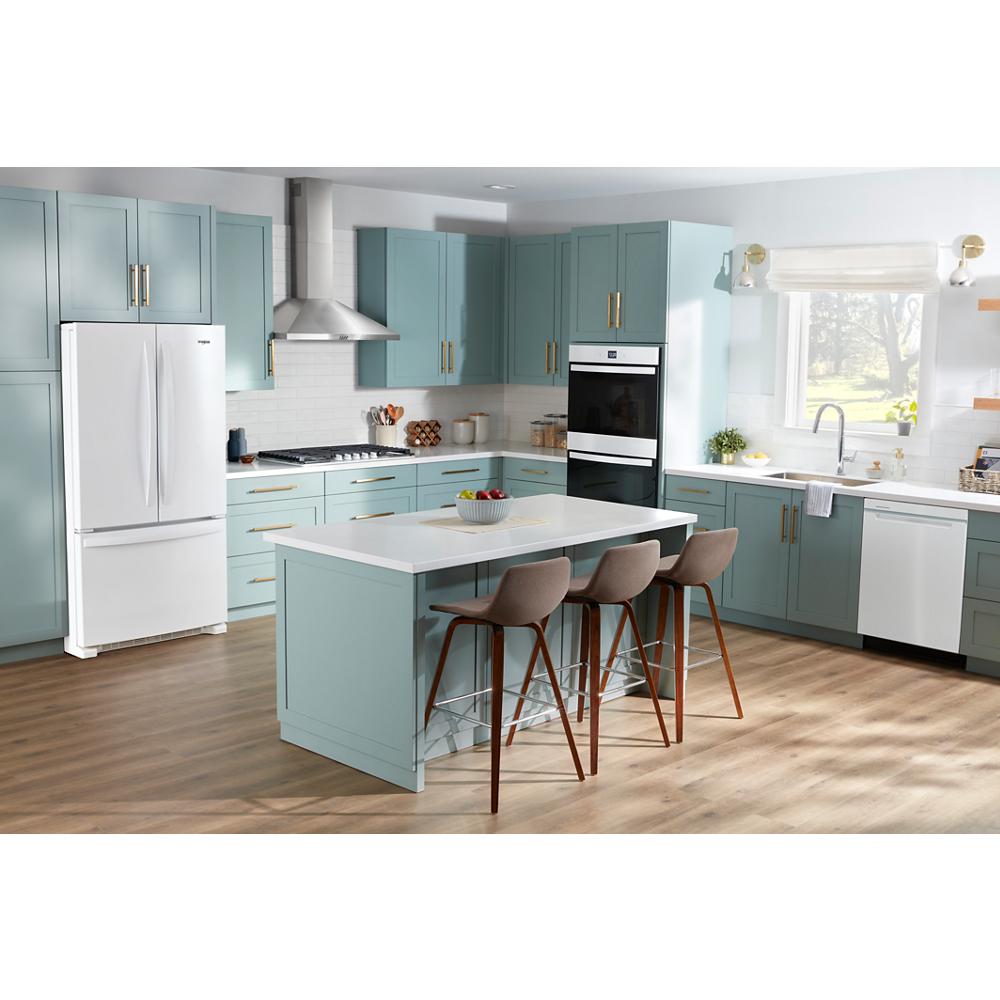 Modern kitchen with light blue cabinetry, white appliances, center island with three stools, and hardwood floor flooring
