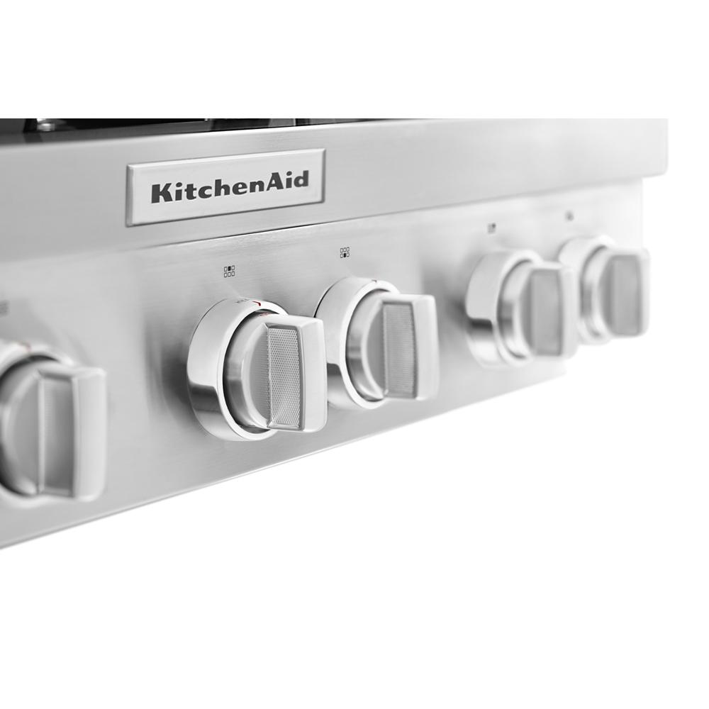 Close-up of stainless steel control knobs on KitchenAid commercial-style gas cooktop in kitchen appliances collection