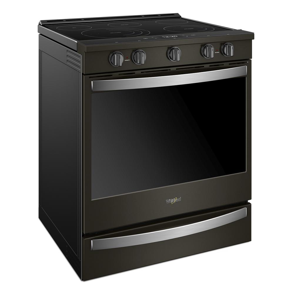 Black Whirlpool electric range with slide-in design, four control knobs, and stainless steel accents for kitchen use