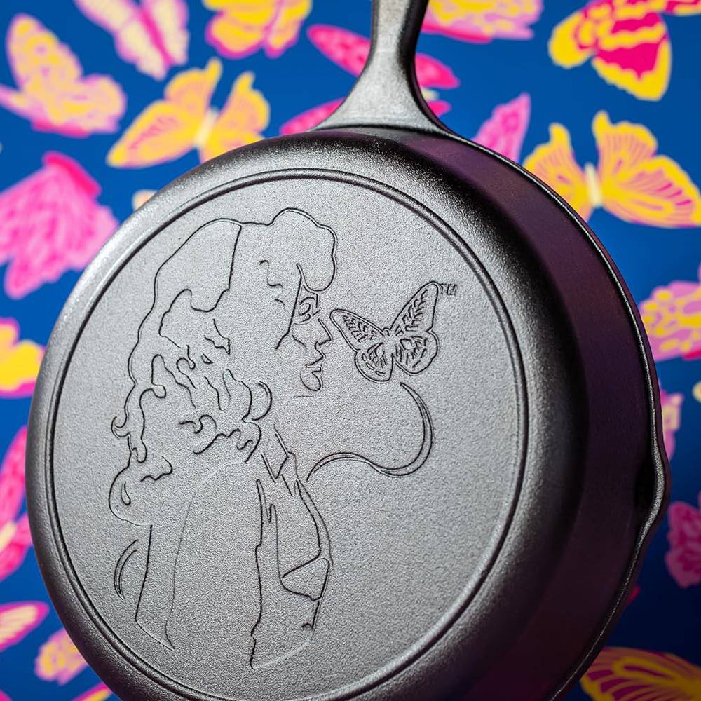 Cast iron skillet with embossed profile and butterfly design on cooking surface, part of Lodge Cast Iron kitchenware collection under $100