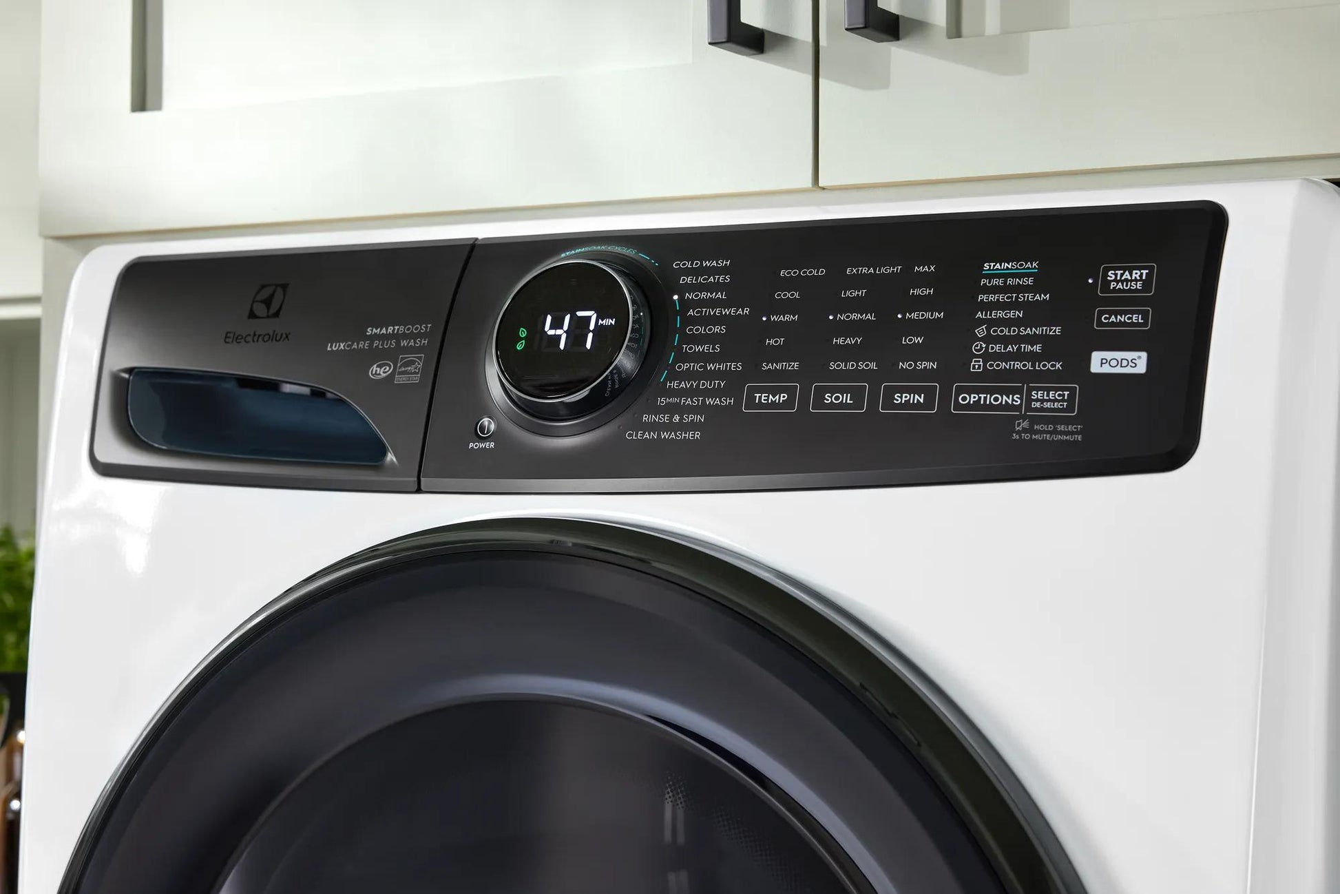 Control panel and digital timer display on white front load washer in washers and appliances collections