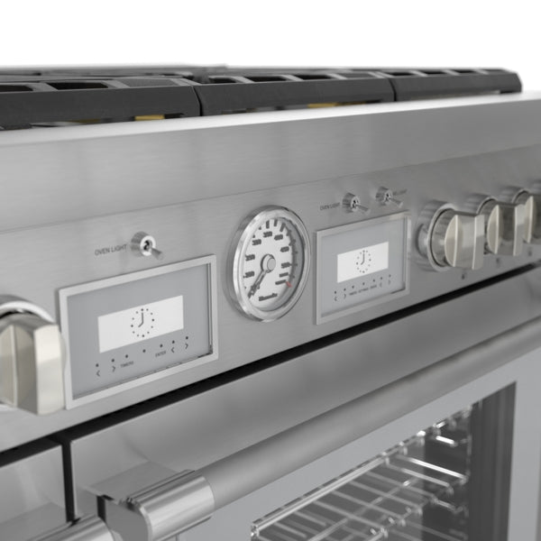 Close-up of stainless steel commercial depth dual fuel range control panel with knobs, gauges, and digital displays from Ranges collection