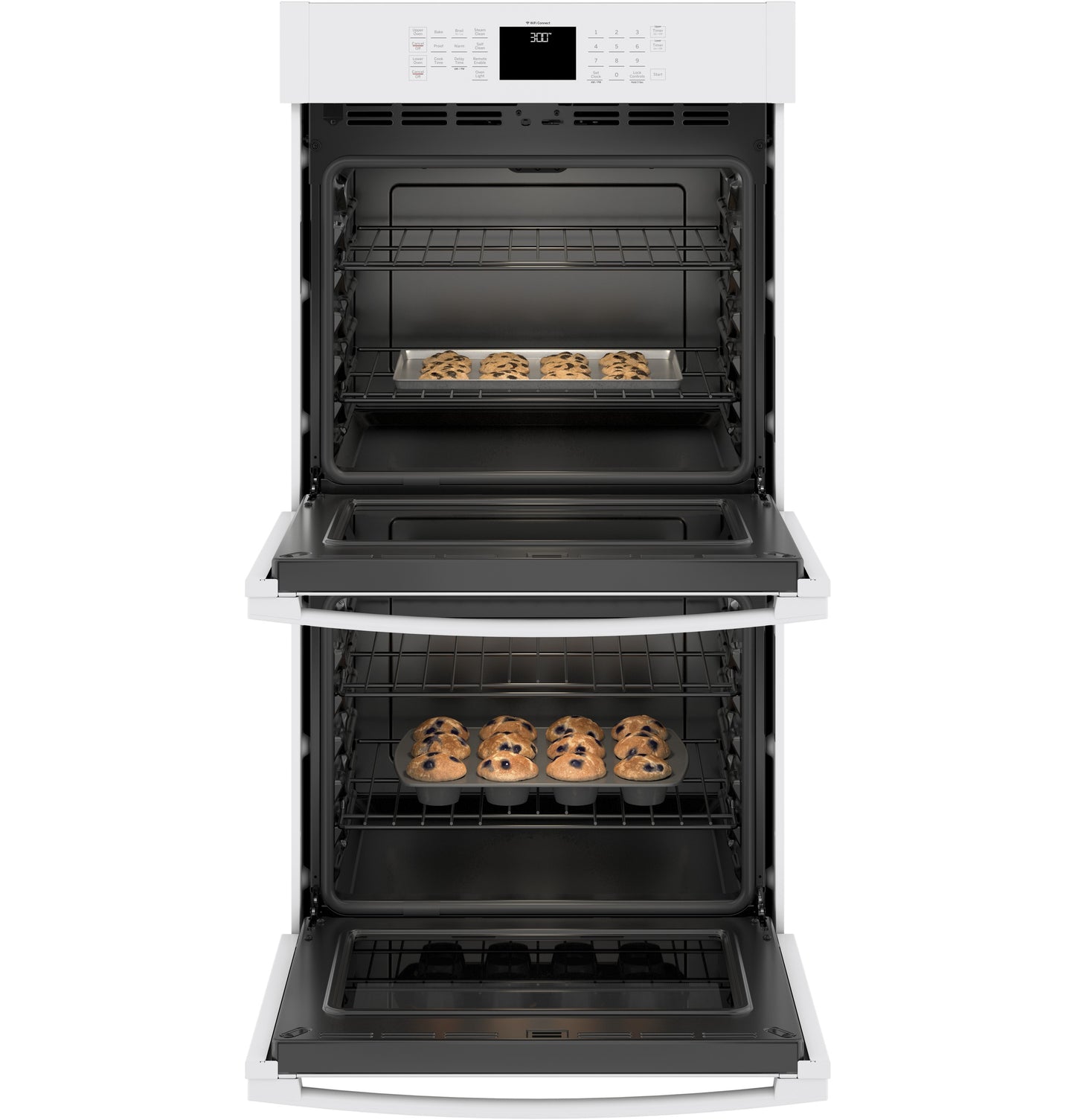 White built-in double wall oven with open doors and trays of cookies baking inside in kitchen appliances collection