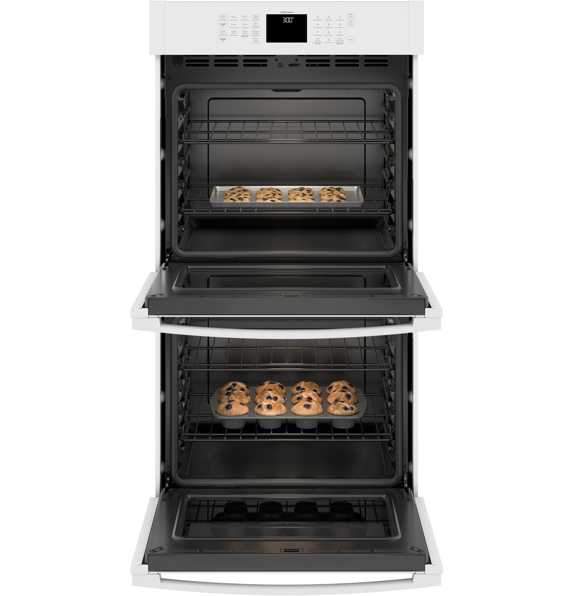 White built-in double wall oven with open doors and trays of cookies baking inside in kitchen appliances collection