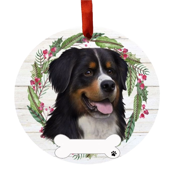 Round Christmas ornament featuring a Bernese Mountain Dog face wreath with greenery and red berries decoration