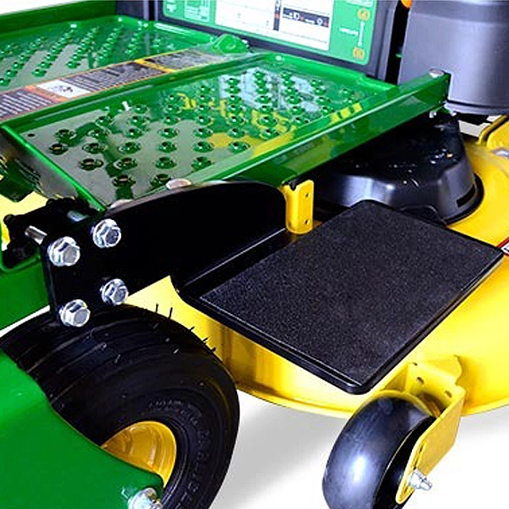 Green and yellow metal boarding step attached to mower deck for safe mounting in John Deere parts and accessories collection