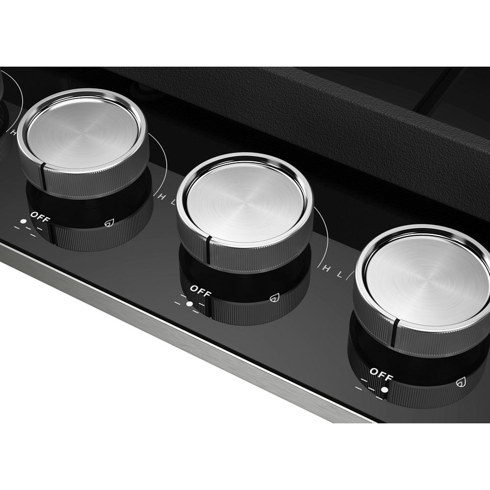 Close-up of three stainless steel control knobs with off and flame icons on black glass cooktop from kitchen appliances collection