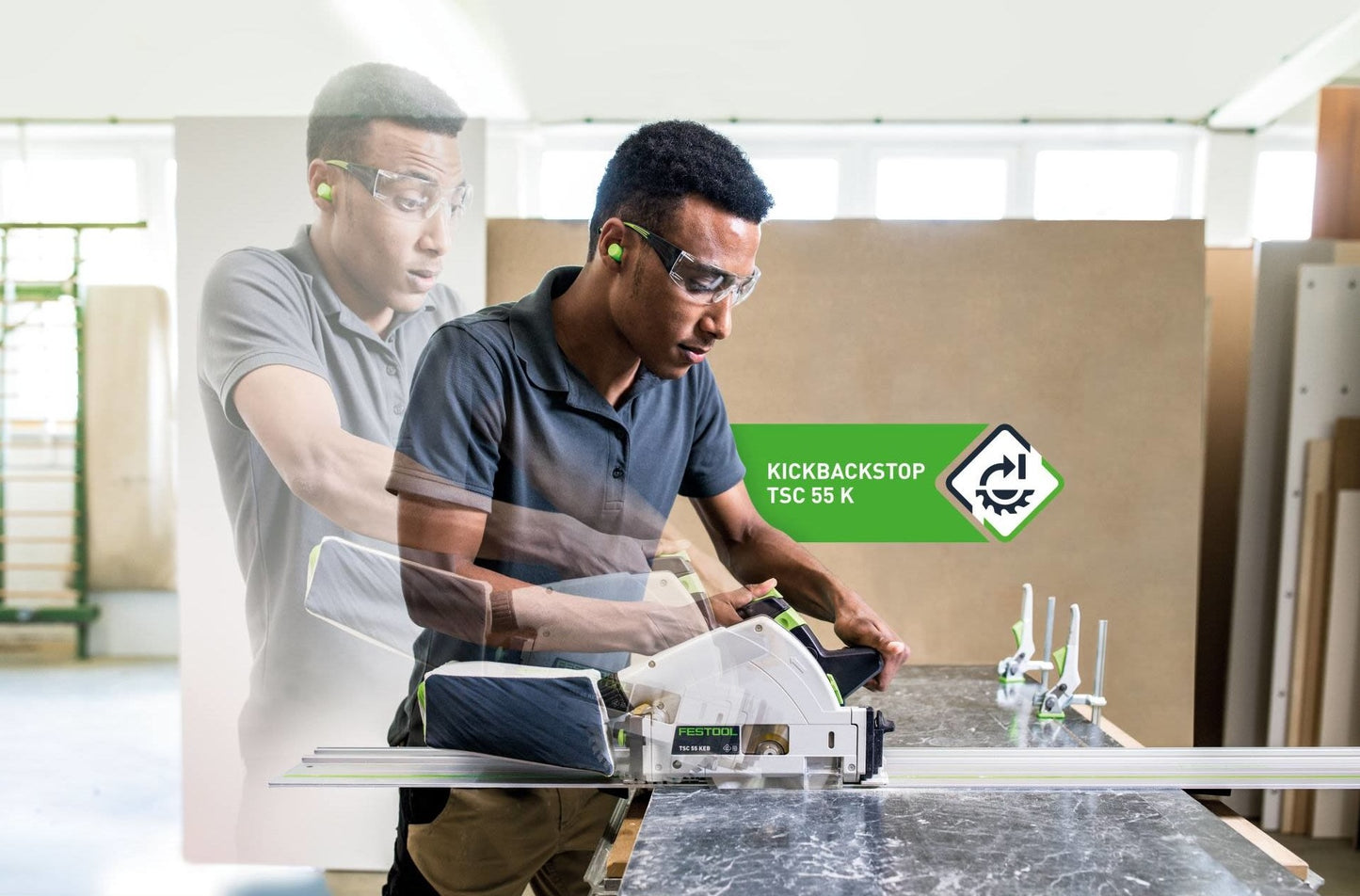 Worker wearing safety glasses and ear protection using a Festool cordless track saw with kickback stop in workshop