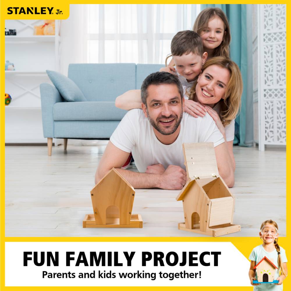 Family assembling wooden bird feeder kit indoors, enjoying a collaborative home improvement activity together