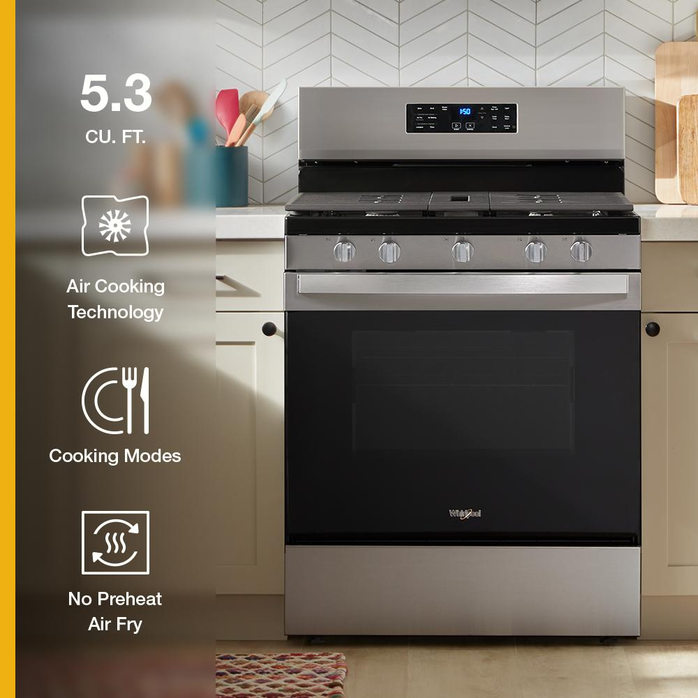 Stainless steel 30-inch gas range with digital control panel and five knobs in kitchen appliances setting